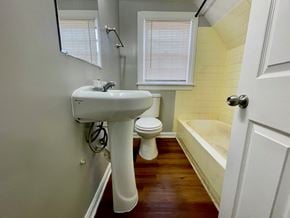 Louisville house for rent - A white sink and toilet in a small bathroom.