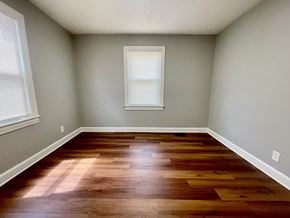Louisville house for rent - A room with wooden flooring and a window.