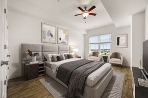 Middletown apartment for rent - A bedroom with a large bed and a ceiling fan.