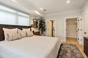 Newark apartment for rent - a bedroom with a large bed and a closet