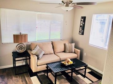 Evans apartment for rent - a living room with a couch and a coffee table
