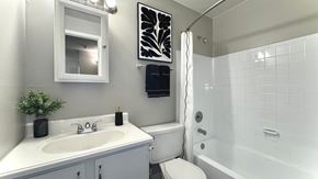 Longmont apartment for rent - a kitchen and living room with a black refrigerator