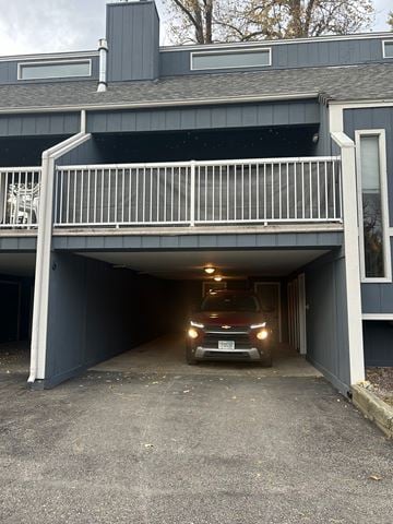Whitefish apartment for rent - A car is parked in a garage attached to a house.