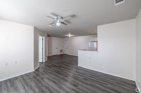 Conway apartment for rent - A spacious room with a ceiling fan and hardwood flooring.
