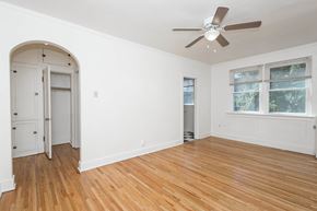 Denver apartment for rent - A room with a ceiling fan and a window.