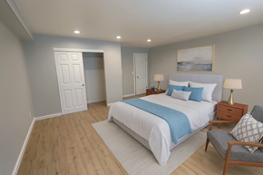 San Jose apartment for rent - A bedroom with a bed, nightstand, and chair.
