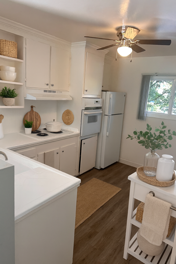 San Jose apartment for rent - A kitchen with white cabinets and a white refrigerator.