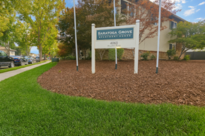 San Jose apartment for rent - A sign for Satogga Grove Apartment Homes stands in a grassy area.