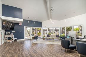 Phoenix apartment for rent - A spacious office with a view of the outside through large windows.