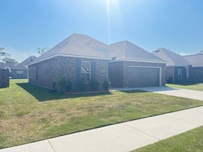 Lafayette house for rent - a house with a lawn and a sidewalk in front of it