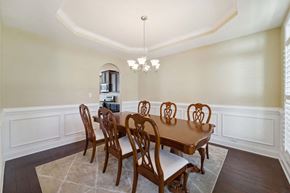 Maple Hill house for rent - a dining room with a wooden table and chairs