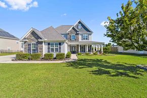 Maple Hill house for rent - the front of a house with a lawn and a driveway