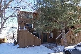 Boulder apartment for rent - A house with a car parked in front of it.