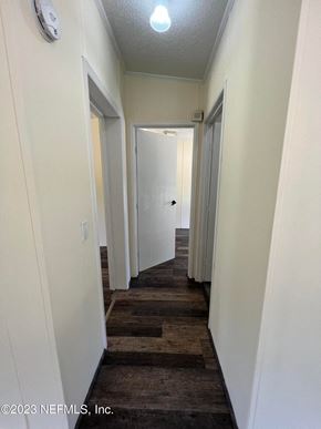 Interlachen house for rent - A hallway with doors on both sides and a light on the ceiling.