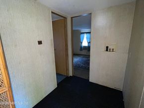 Interlachen house for rent - A room with a door leading to a bedroom.