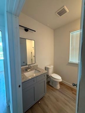 San Antonio apartment for rent - A bathroom with a sink, toilet and mirror.