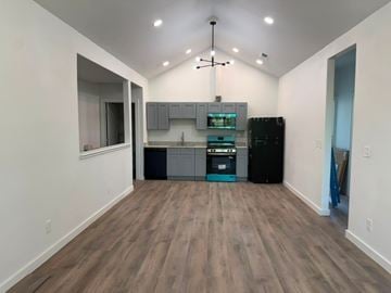 San Antonio apartment for rent - A kitchen area with a black refrigerator and a sink.