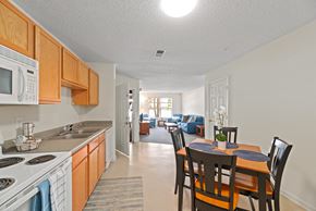 Farmville apartment for rent - a kitchen and dining room with a dining table and chairs