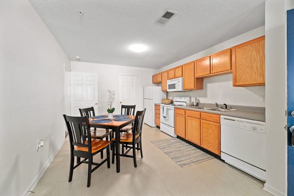 Farmville apartment for rent - a kitchen and dining room with a table and chairs
