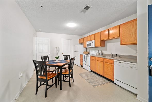 Farmville apartment for rent - a kitchen and dining room with a table and chairs