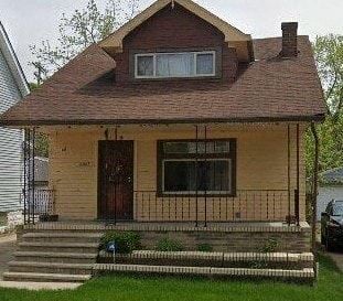 Cleveland house for rent - A small house with a brown door and a brown roof.