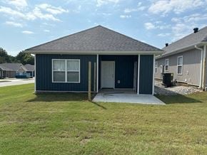 Little Rock house for rent - a blue house with a porch and a driveway
