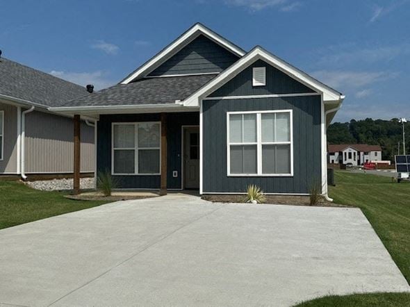Little Rock house for rent - a blue house with a white sidewalk in front of it