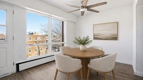 Regina apartment for rent - A dining room with a round table and chairs.