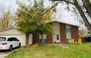 Fort Collins apartment for rent - a woman is hiding her face behind a blanket