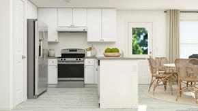 San Antonio house for rent - a white kitchen with a table and chairs and a refrigerator