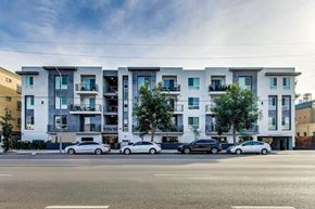 North Hollywood apartment for rent - a city street with cars parked in front of an apartment building