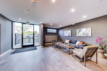 North Hollywood apartment for rent - a living room with a couch and chairs and sliding glass doors