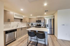 North Hollywood apartment for rent - a modern kitchen with stainless steel appliances and a white counter top