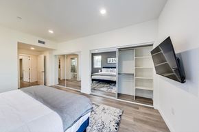 North Hollywood apartment for rent - a bedroom with a bed and a closet with a tv