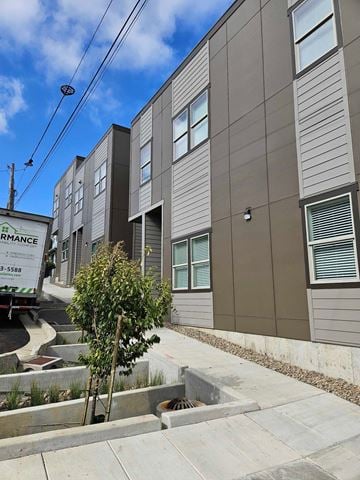 Oregon City house for rent - a row of new apartment buildings with a truck parked in front