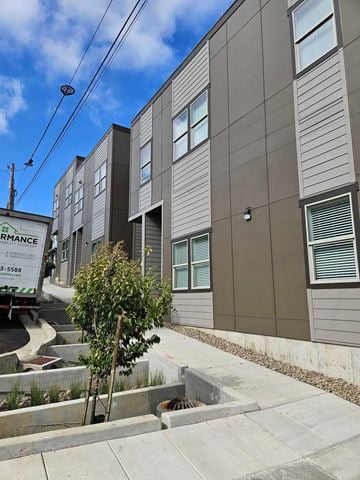 Oregon City house for rent - a row of new apartment buildings with a truck parked in front