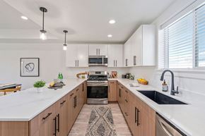 Salt Lake City apartment for rent - a large kitchen with wooden cabinets and white counter tops