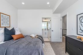 Salt Lake City apartment for rent - a bedroom with a bed and a door to a bathroom