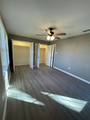 Abilene house for rent - A room with a ceiling fan and light, and a wood floor.