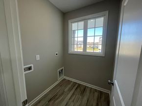 Wilson house for rent - a room with a window and wooden floors