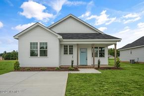 Wilson house for rent - the front of a white house with a blue door