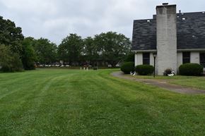 Crown Point apartment for rent - a house with a large yard and a lawn