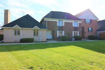 Crown Point apartment for rent - a large brick house with a lawn in front of it