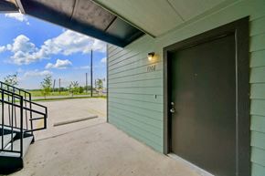 San Antonio apartment for rent - the front door of a building with a ramp leading up to it