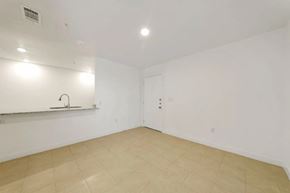 San Antonio apartment for rent - an empty living room with white walls and a sink