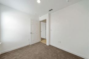 San Antonio apartment for rent - a bedroom with white walls and a door to a closet