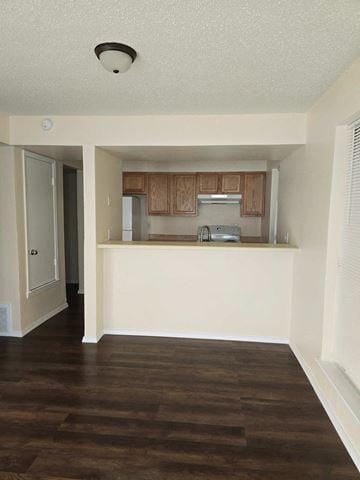 Atoka apartment for rent - A kitchen with wooden floors and white walls.