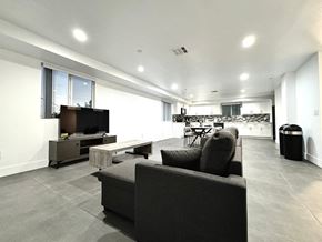 Los Angeles apartment for rent - a large living room with a couch and a television