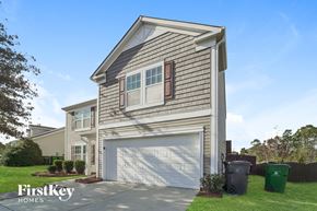 Charlotte house for rent - the exterior of a home with a white garage door