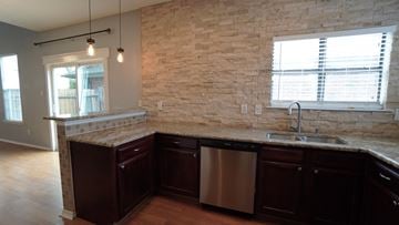 Mesquite house for rent - a kitchen with a counter top and a sink